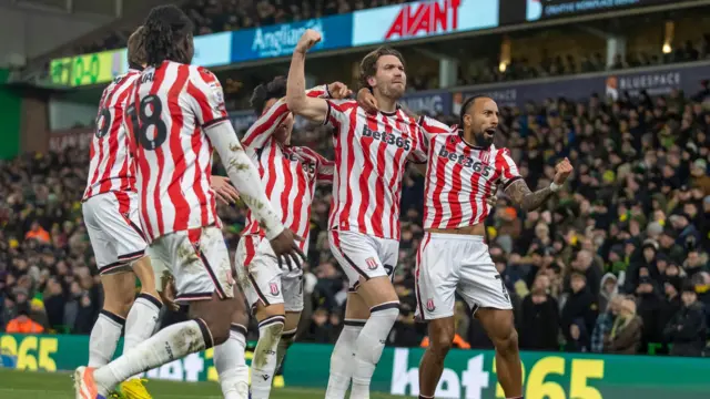 Stoke City's Sam Gallagher celebrating his goal alongside his teammates
