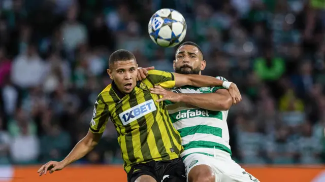 Kairat's Edmilson and Celtic's Cameron Carter-Vickers in action