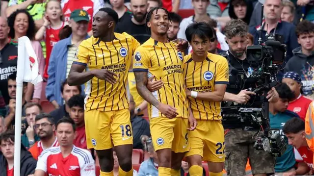 Brighton players celebrate a goal