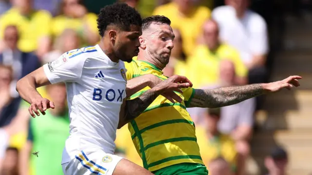 Norwich and Leeds players challenge for the ball