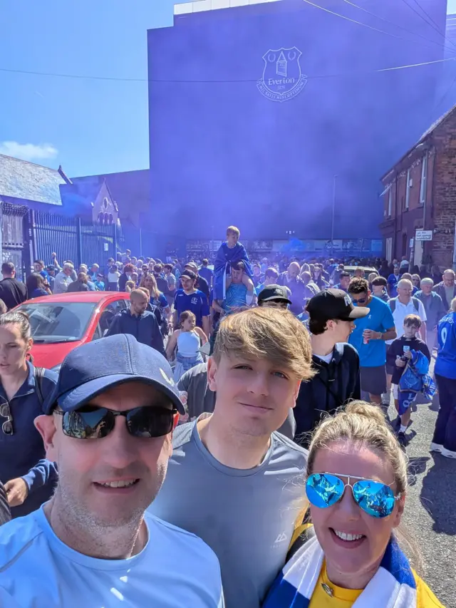 Supporters smiling outside Goodison Park 