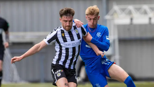 St Mirren's Ryan Strain and Rangers' Ross McCausland in action during a cinch Premiership match between St Mirren and Rangers 