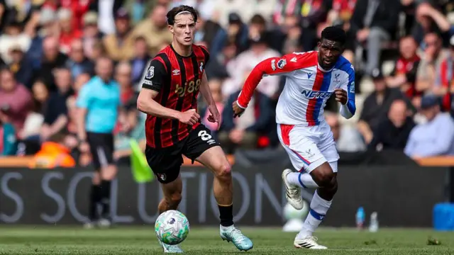  Alex Scott of Bournemouth dribbles away from Jefferson Lerma of Crystal Palace 