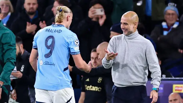 Pep Guardiola with Erling Haaland