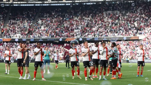 Luton players applauding their away fans 