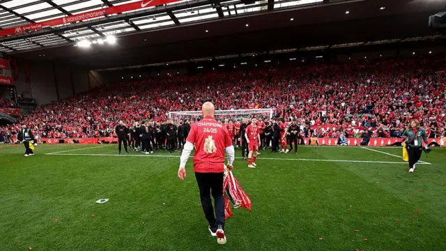 Arne Slot celebrates with the Premier League trophy