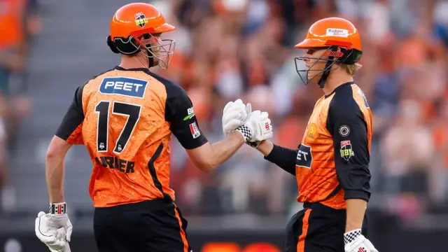 Cooper Connolly and Ashton Turner punch gloves during Perth Scorchers' win over Melbourne Stars in the Big Bash