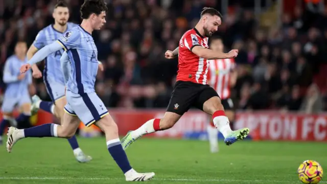 Adam Armstrong of Southampton takes a shot during the Premier League match between Southampton FC and Tottenham Hotspur FC at St Mary's Stadium