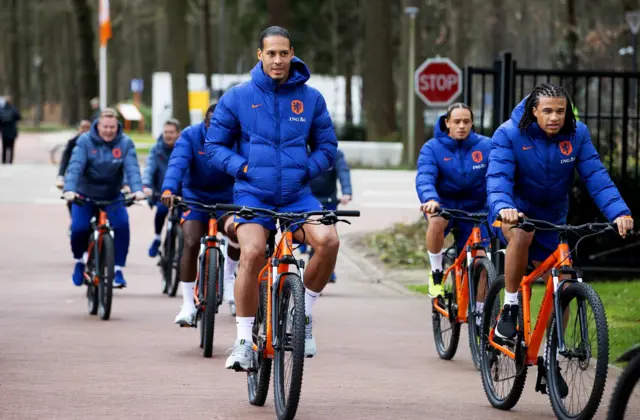 Netherlands captain Virgil van Dijk on a bike