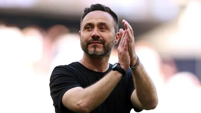 Roberto De Zerbi, Manager of Tottenham Hotspur, applauds the fans.