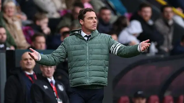 Scott Parker holds his arms outstretched