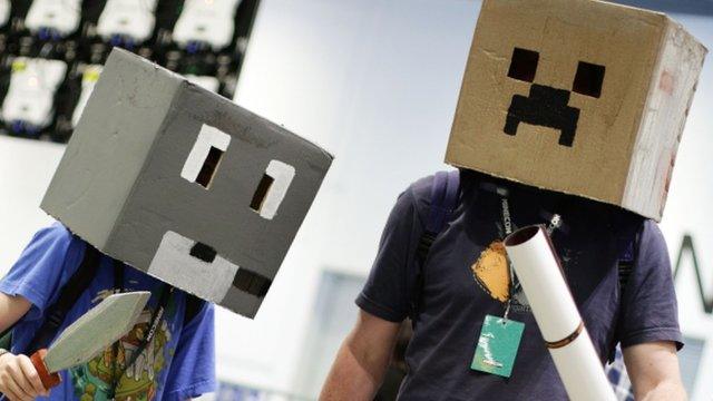 Minecraft fans wearing painted boxes on their heads to resemble Minecraft characters