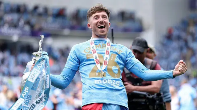 Josh Eccles of Coventry City celebrates with the Championship trophy