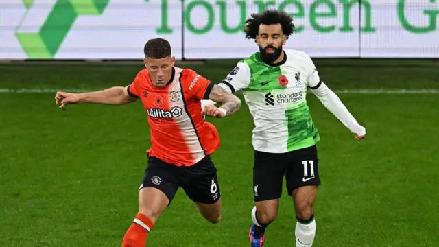 Mohamed Salah of Liverpool with Ross Barkley of Luton during the Premier League match between Luton Town and Liverpool FC