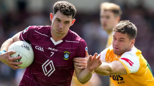 Sam McCartan and Patrick McBride battle for the ball 