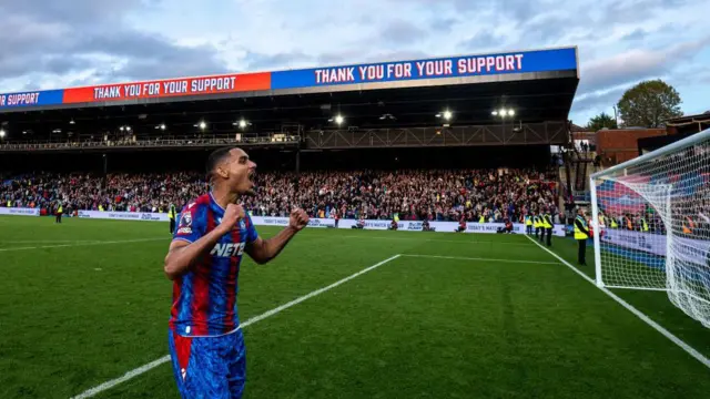 Maxence Lacroix celebrates with Crystal Palace supporters