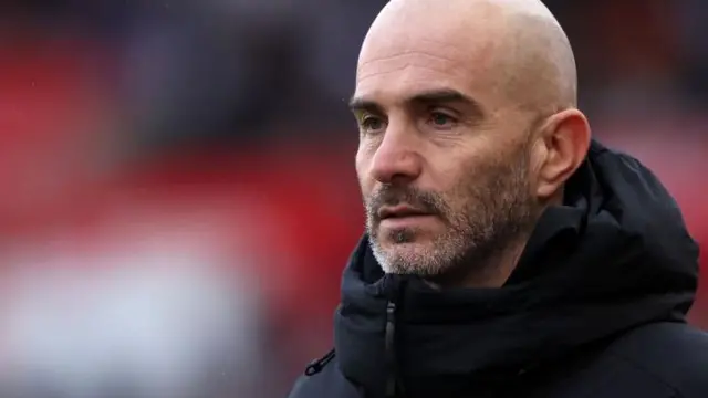 Enzo Maresca stands on the touchline watching Leicester City