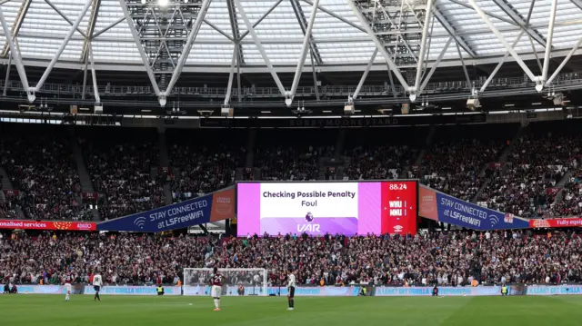 Image of VAR decision on big screen at London Stadium