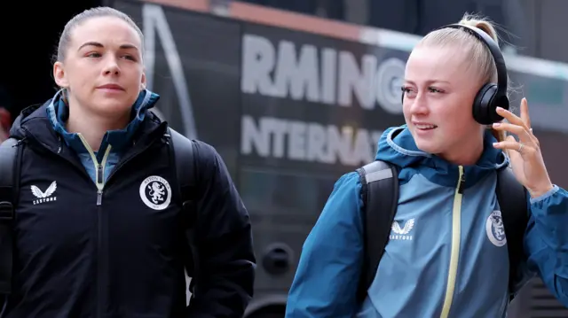 Kirsty Hanson and Freya Gregory of Aston Villa arrive at the stadium prior to the Barclays Women's Super League match between Manchester United and Aston Villa at Leigh Sports Village