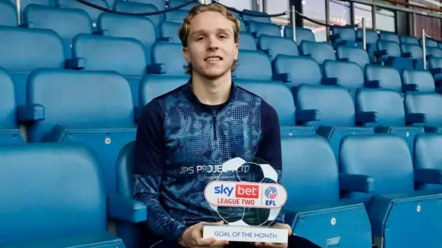 Sammy Braybrooke with his goal of the month trophy 