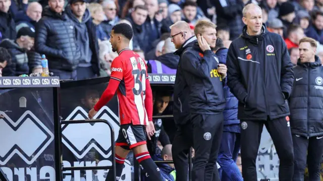 Sheffield United's Mason Holgate leaves the field after being shown a red card during the game against Brighton at Bramall Lane 