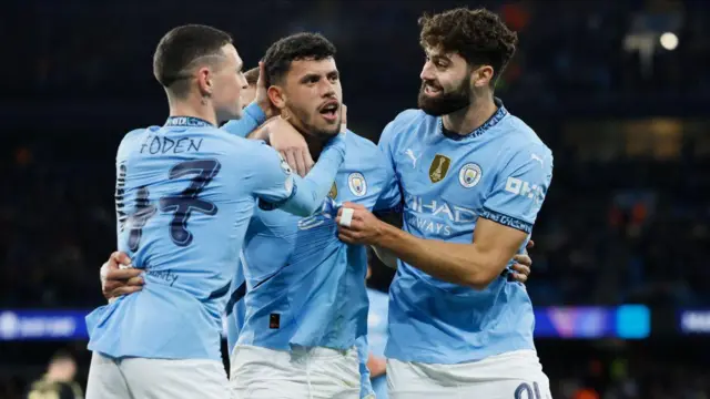 Matheus Nunes, Phil Foden and Josko Gvardiol of Manchester City celebrate 5th goal during the UEFA Champions League 2024/25 League Phase MD3 match between Manchester City and AC Sparta Praha at City of Manchester Stadium on October 23, 2024