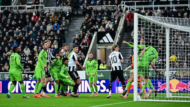 Lewis Miley of Newcastle United scores