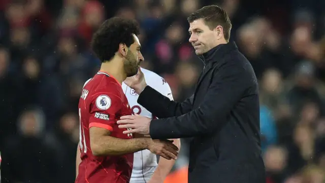 Steven Gerrard embraces Mohamed Salah during his time as Aston Villa manager following Liverpool playing Villa