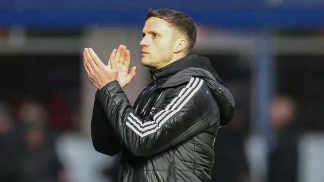Leicester caretaker boss Andy King applauds the Foxes fans after their 2-1 defeat at Birmingham