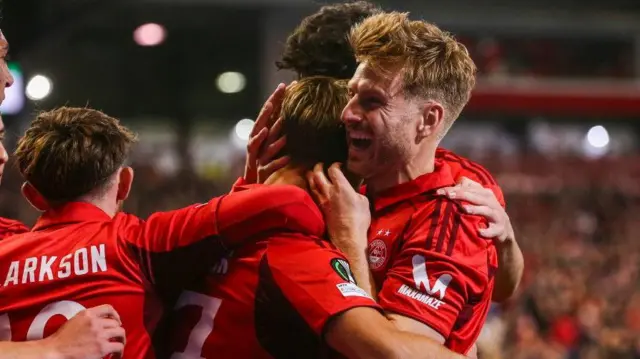Stuart Armstrong celebrates with penalty scorer Jesper Karlsson