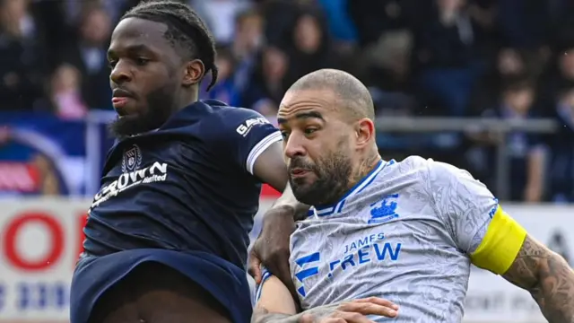 Kilmarnock's Kyle Vassell and Dundee's Billy Koumetio