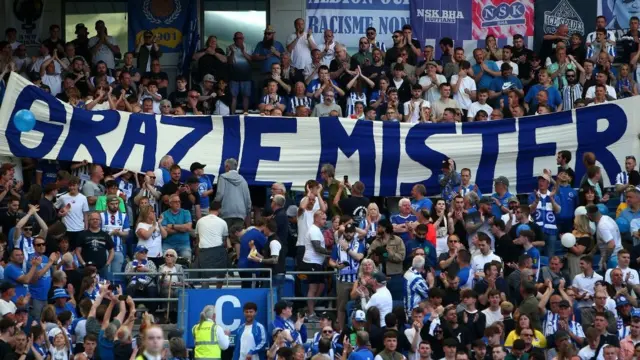 Brighton fans display a 'Grazie Mister' sign for Roberto de Zerbi