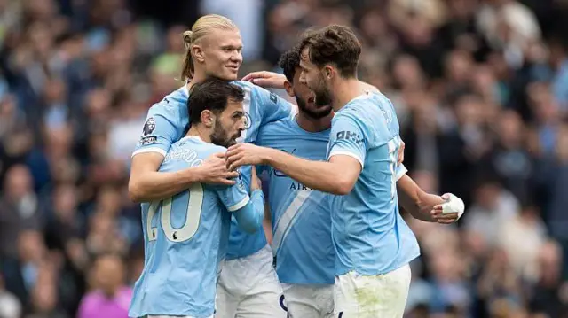Manchester City players celebrate during their weekend win over Burnley
