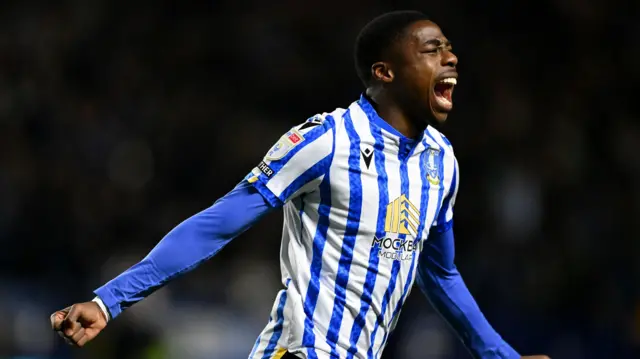 Anthony Musaba celebrating in a Sheffield Wednesday blue and white striped home shirt during their match against Derby in January 2025