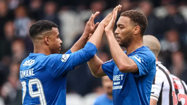 Hamza Igamane and Cyriel Dessers celebrate