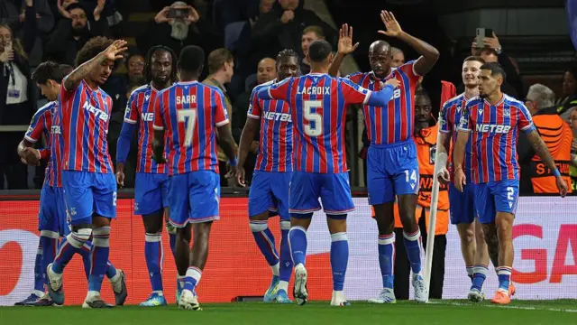 Jean-Philippe Mateta of Crystal Palace celebrates with teammates.