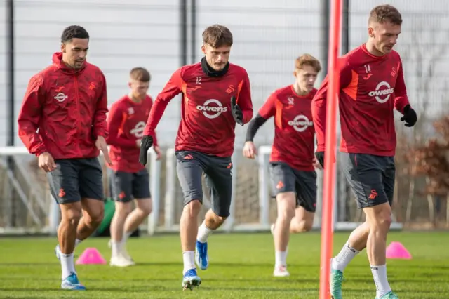 Ben Cabango, Jamie Paterson and Josh Tymon in Swansea training as they prepare for a trip to Hull