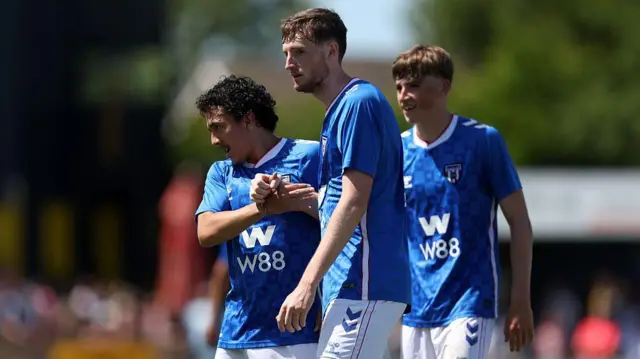 Joe Anderson celebrates with Ian Poveda