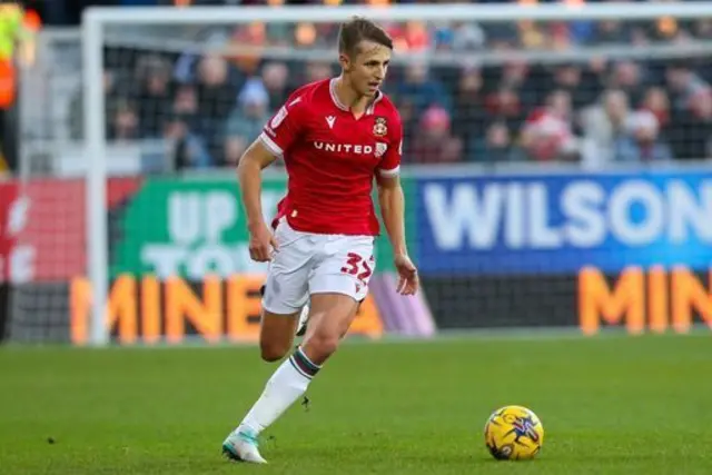 Wrexham's Max Cleworth with the ball at his feet