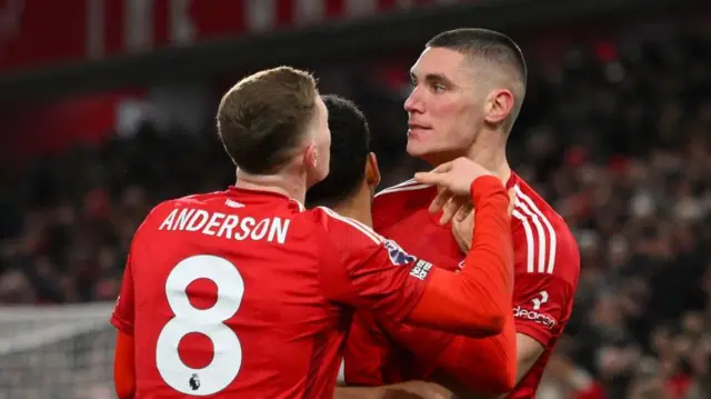 Elliot Anderson and Nikola Milenkovic celebrate a Nottingham Forest goal