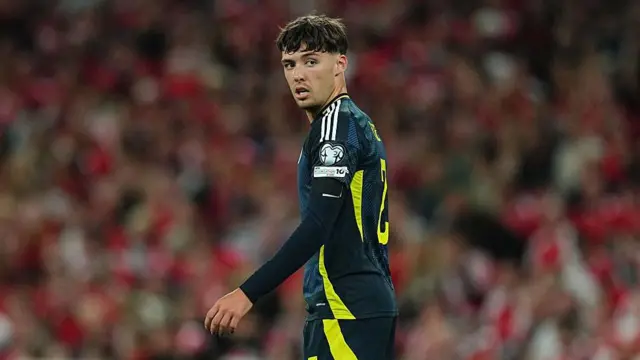 Aaron Hickey playing for Scotland