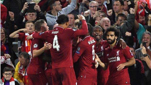 Liverpool's players celebrate scoring against Paris St-Germain in the Champions League