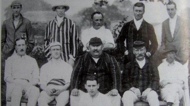 Eleven members of the Castle Cary cricket team looking at the camera