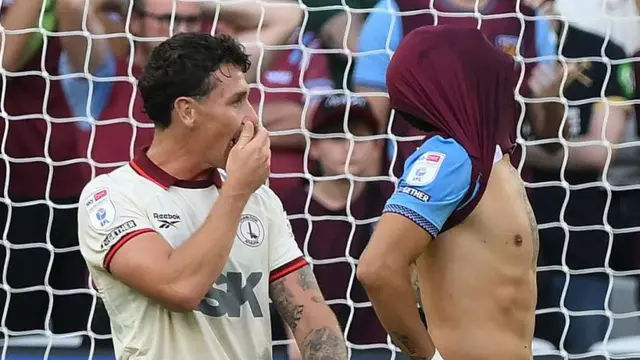West Ham United's Valentin Castellanos (right) stands with his shirt over his head after missing a late penalty against Charlton Athletic