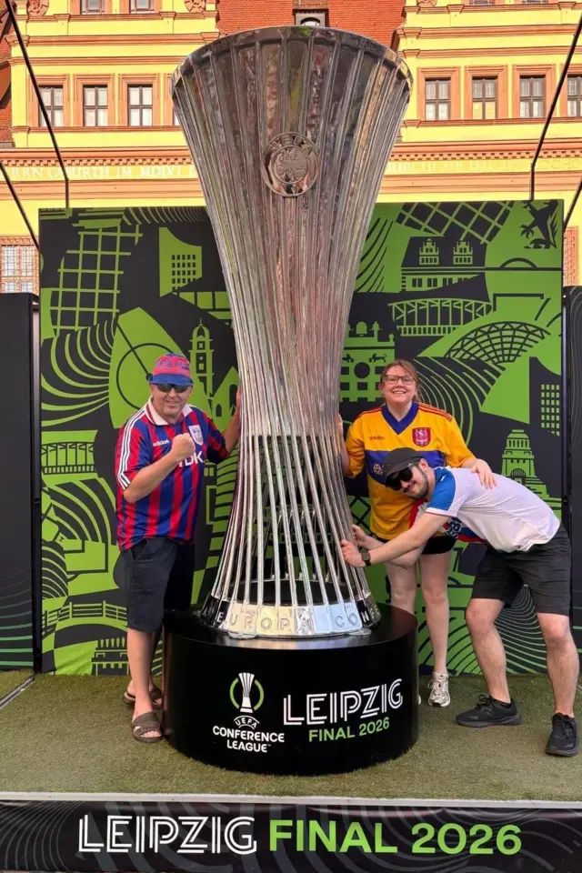 Crystal Palace fans pose with Conference League trophy