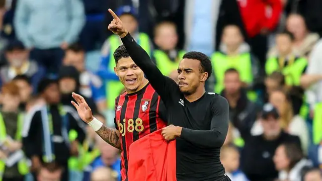 Evanilson looks on as Junior Eli Kroupi celebrates a goal