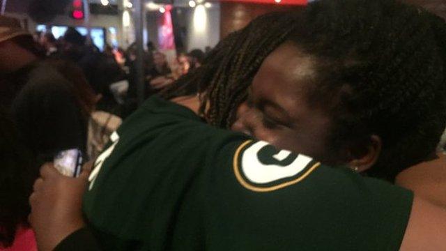 Shows Robyn and Bayana hugging and celebrating