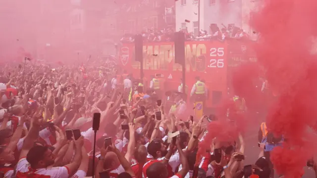 Arsenal supporters cheer their team