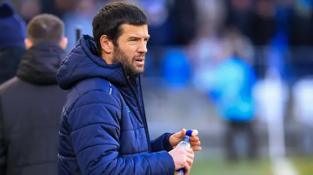 Brian Barry-Murphy looks on form the touchline holding a water bottle