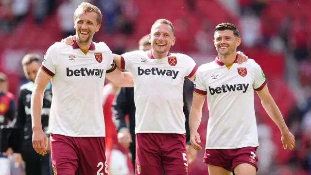 West Ham players celebrate a win at Manchester United